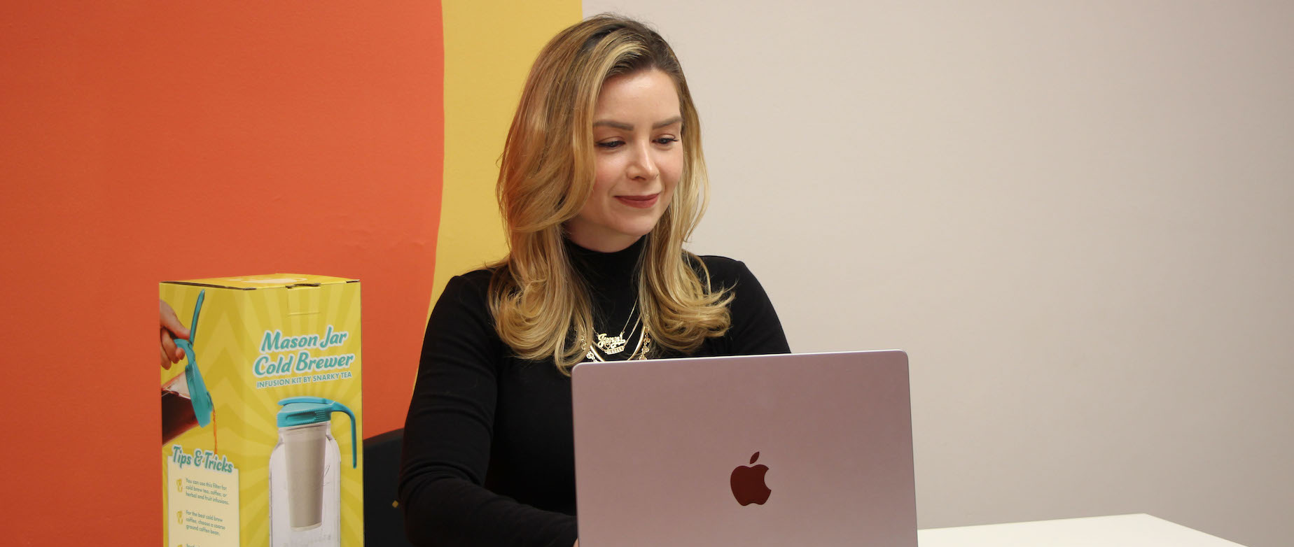 Jenni-Lyn Williams, CEO, working at the Snarky Tea fulfillment center