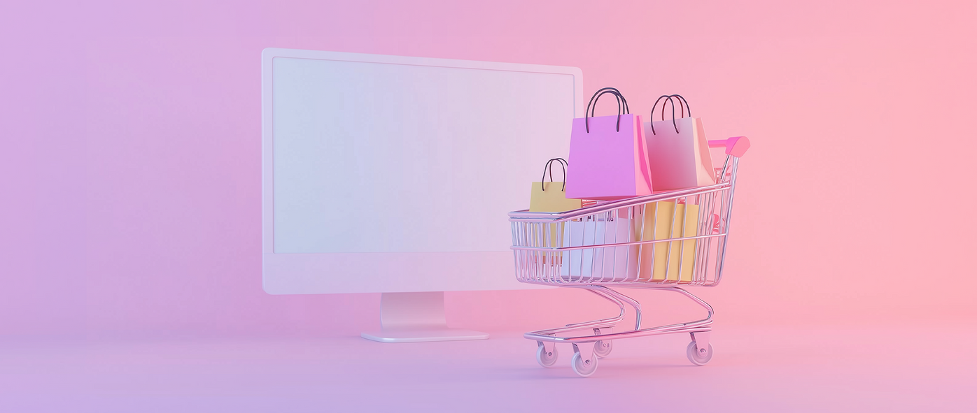 a computer monitor and shopping cart filled with shopping bags, representing ecommerce marketing: how to design shopify website.