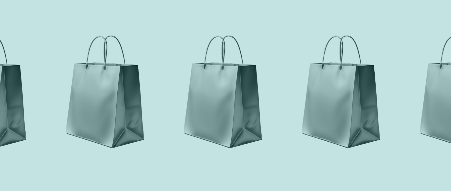 Shopping bags in a row on a light blue background.