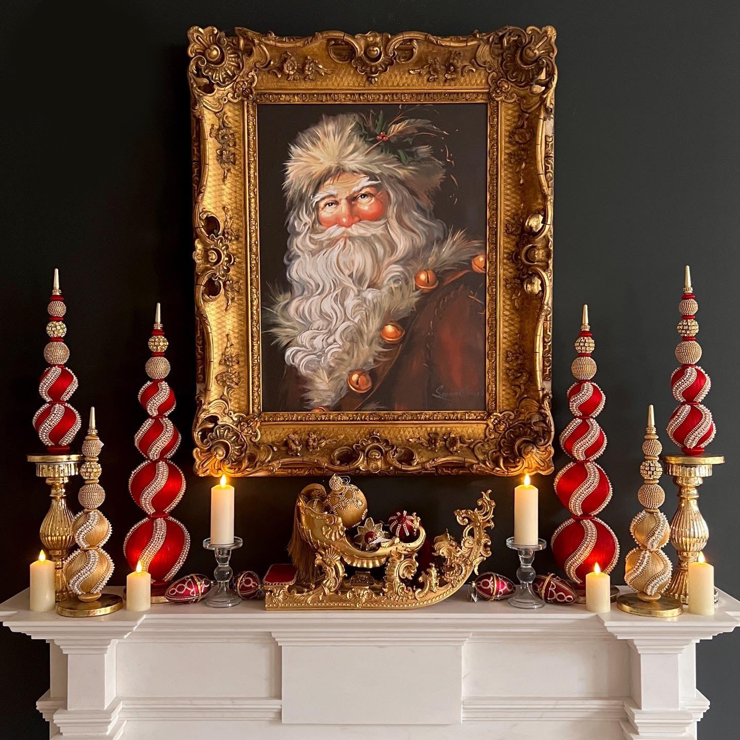 Photo of mantle with framed photo of Santa and ornaments