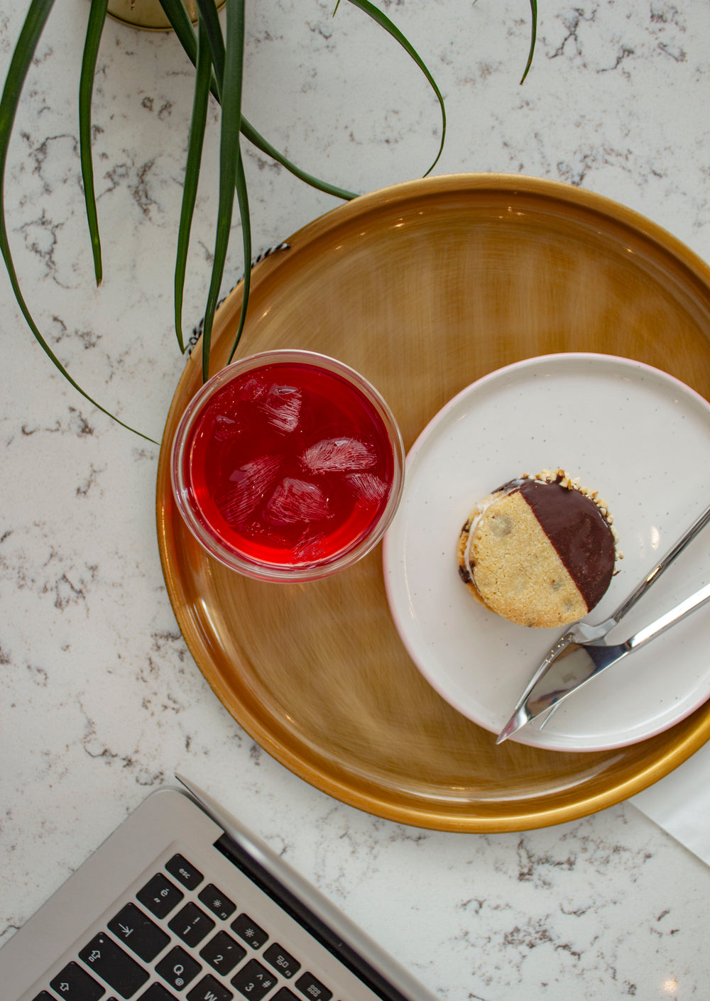 an ice-cream sandwich and a glass of red juice