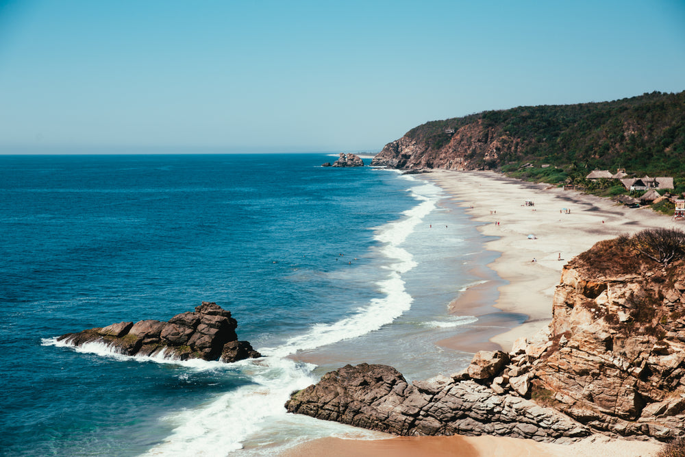 blue ocean with sandy beach