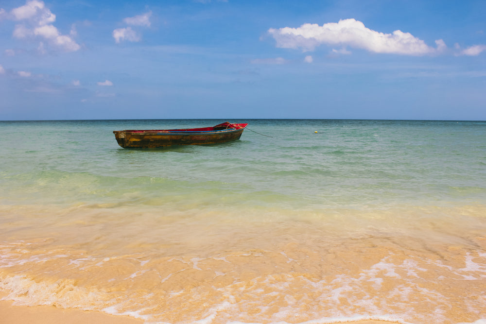 boat in clear blue ocean