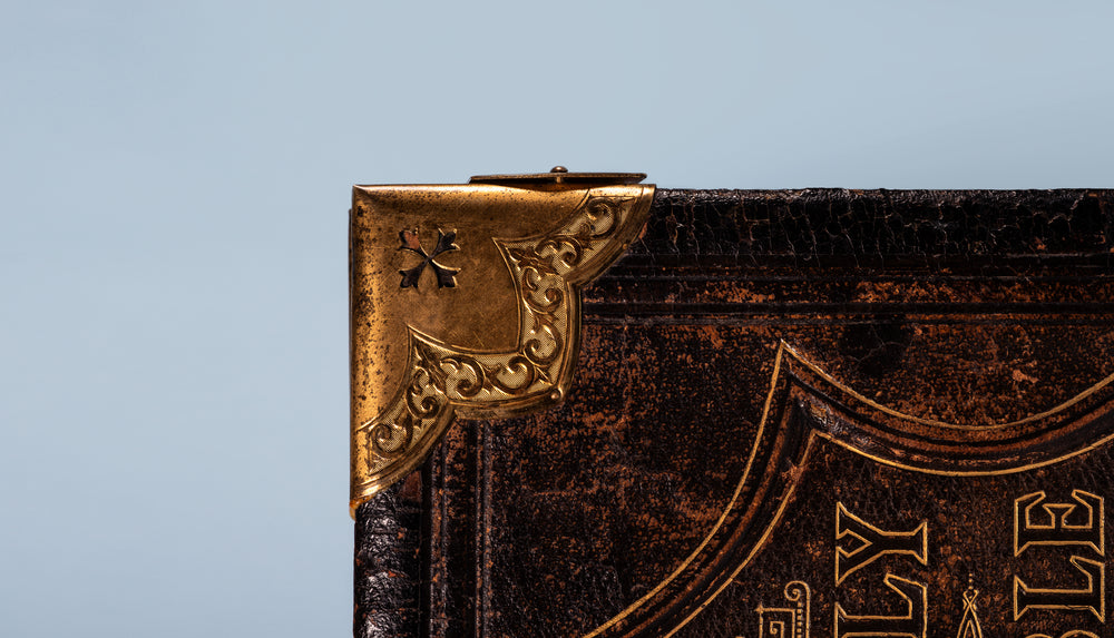 brass cap on the corner of bible