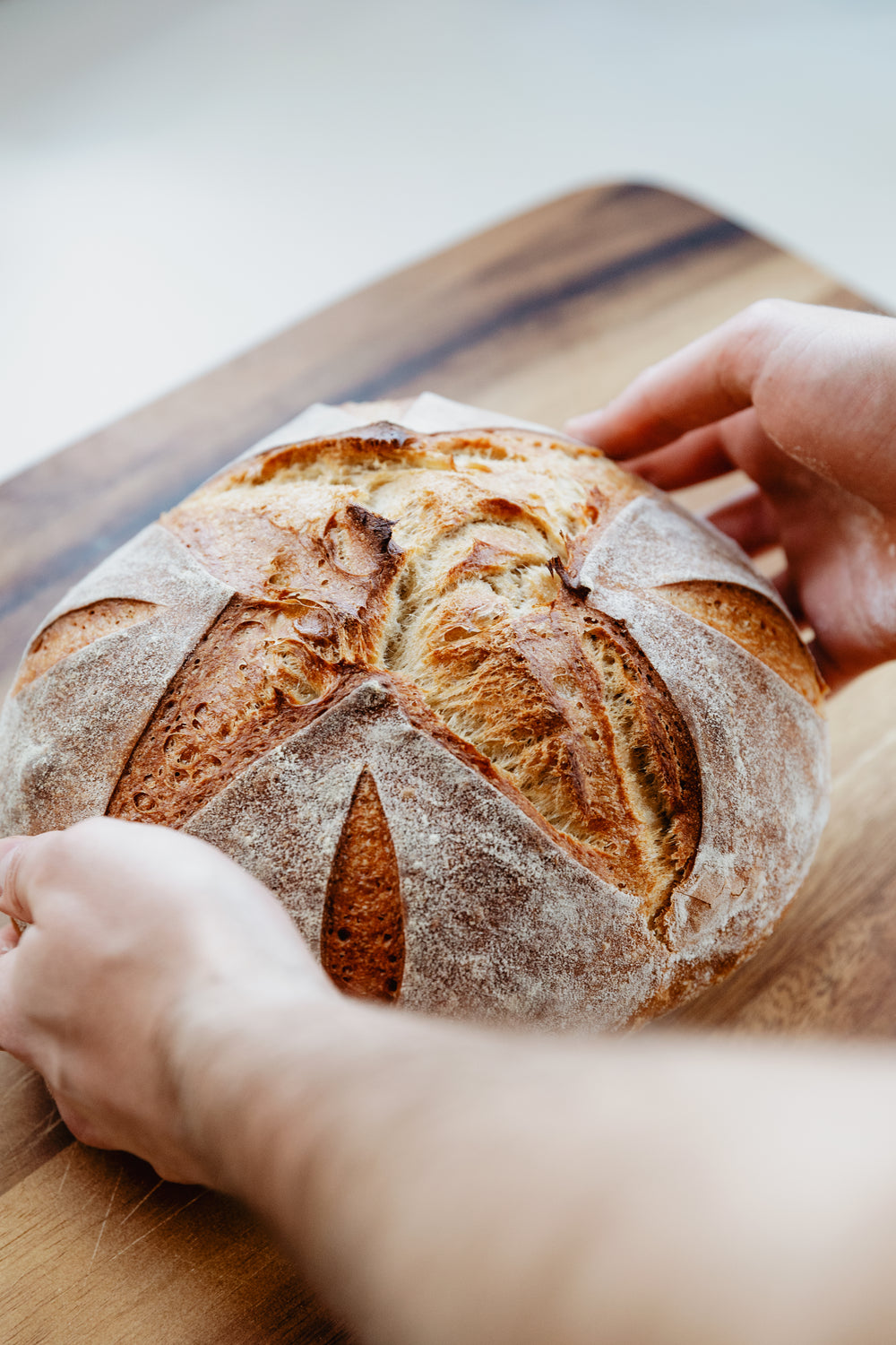 bread loaf on a wooden cutting board