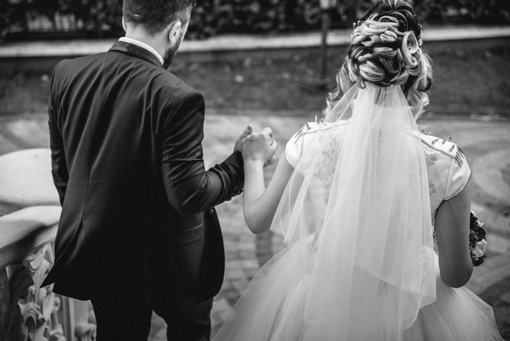 bride and groom on steps