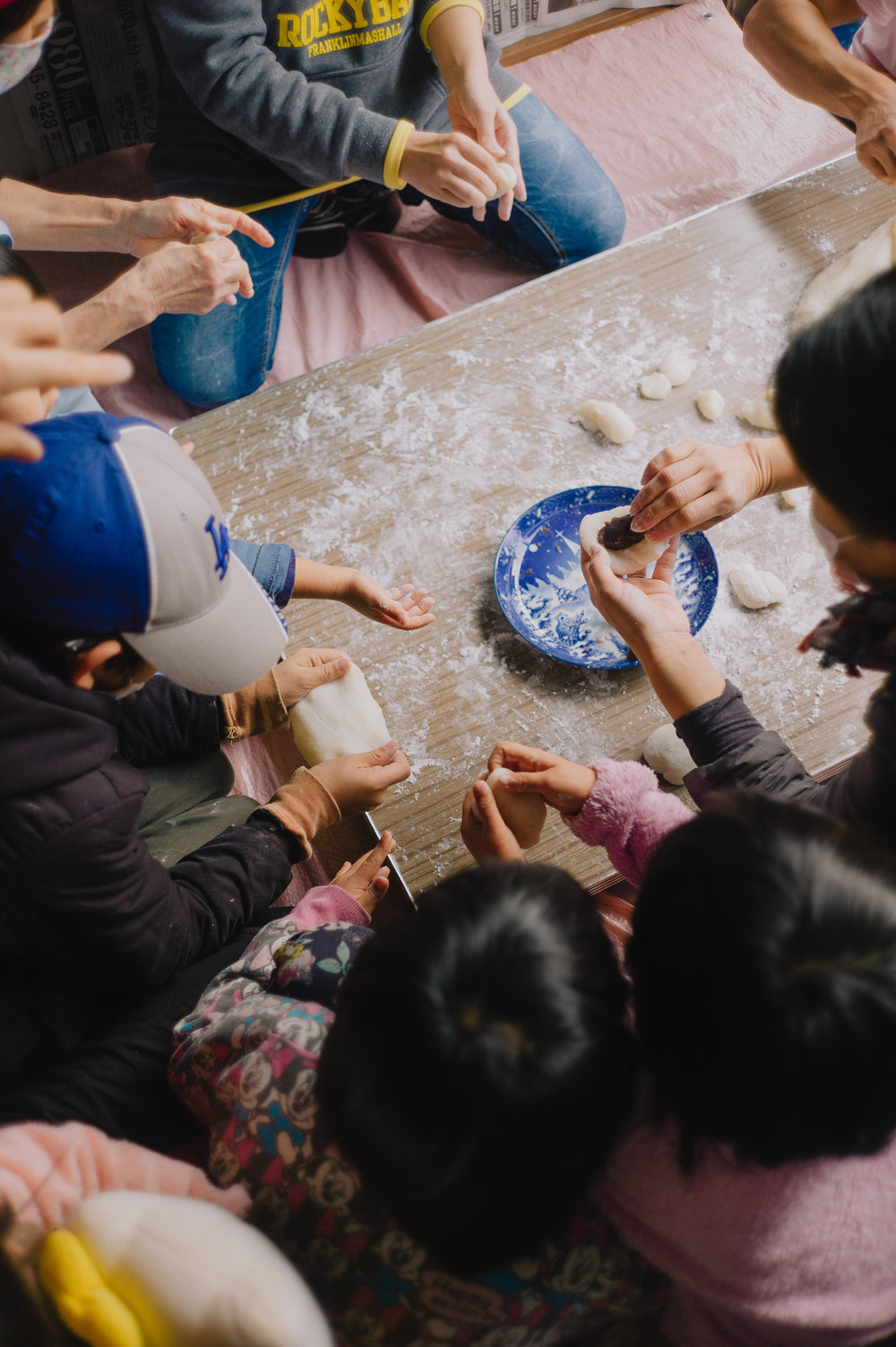 busy hands playing with white dough