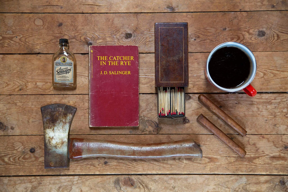 camping flatlay with classic book