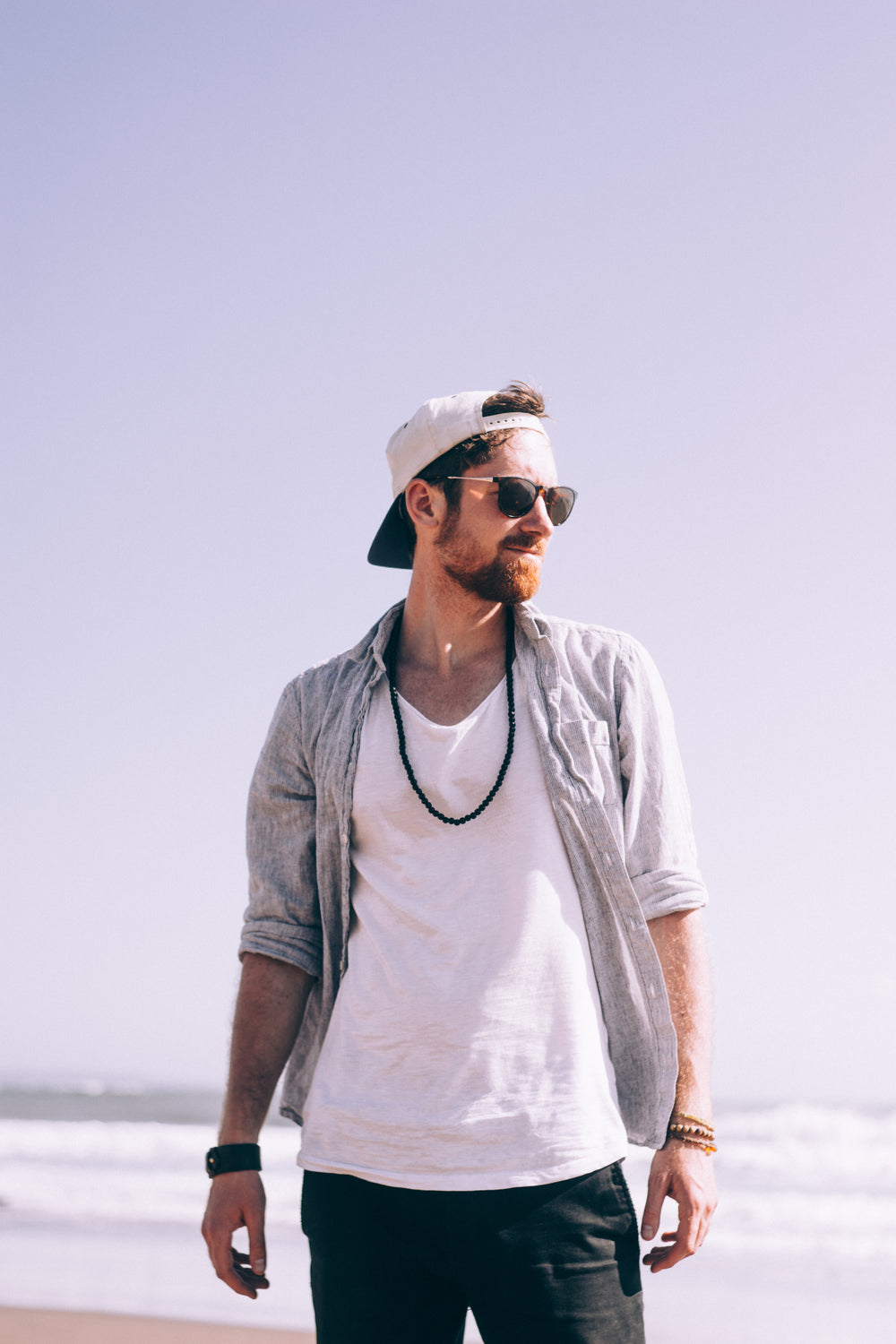 casually dressed man at the beach