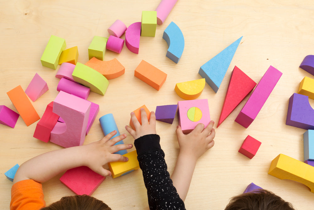 children sharing and playing with toys