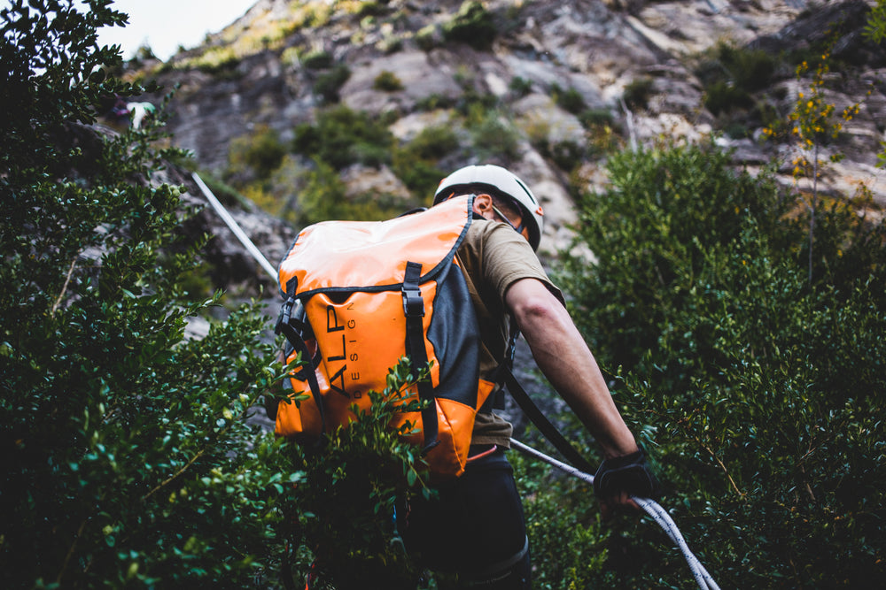 climber rappelling a mountain