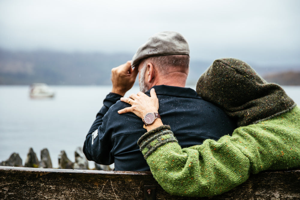 couple sits in british rain