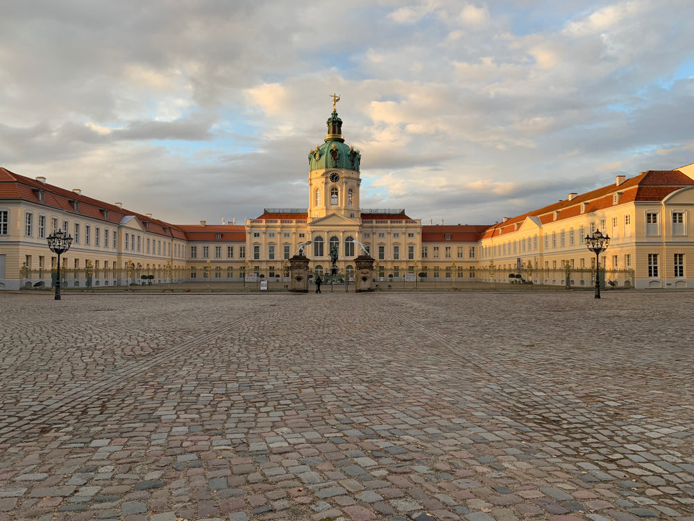 empty cobblestone courtyard to a palace