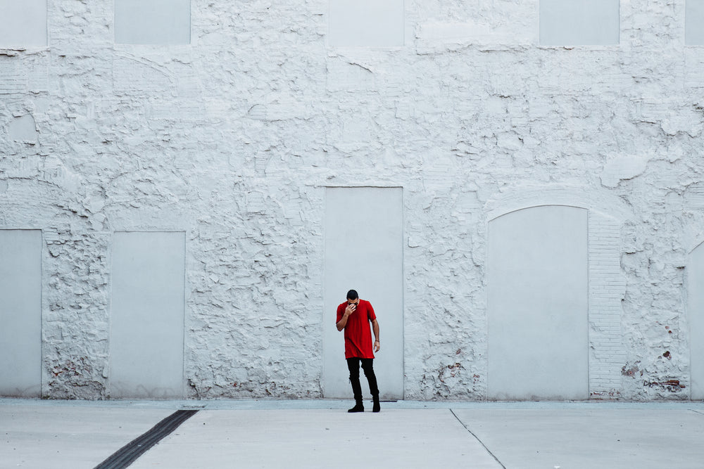 fashionable man by textured wall