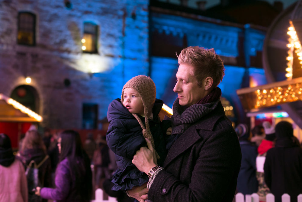 father and daughter at outdoor market