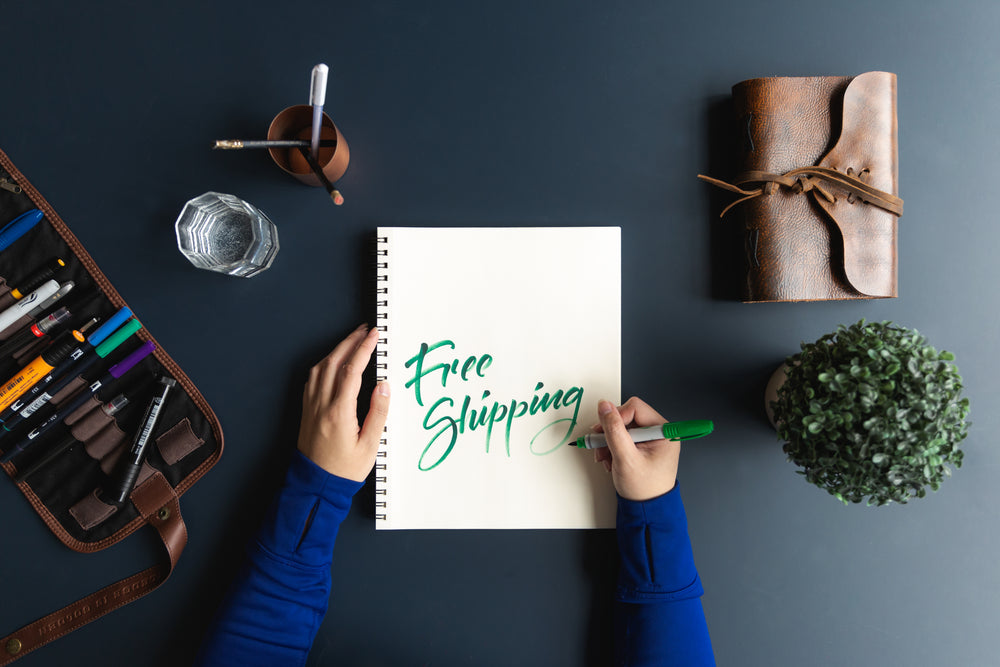 free shipping written in notebook