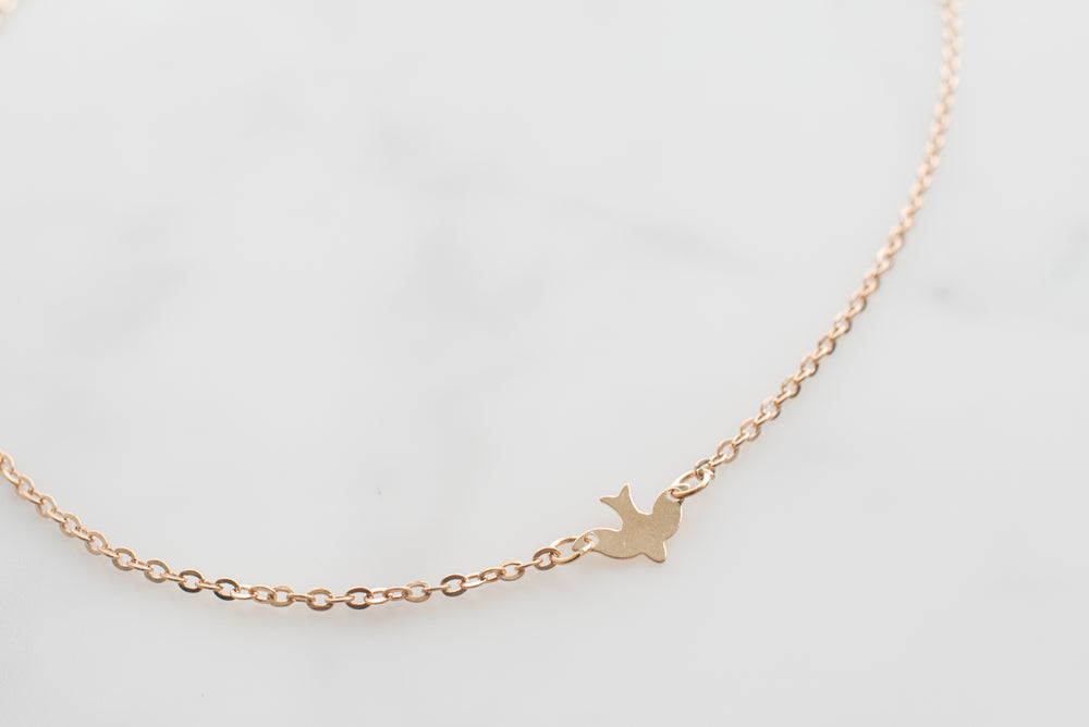 gold bird necklace