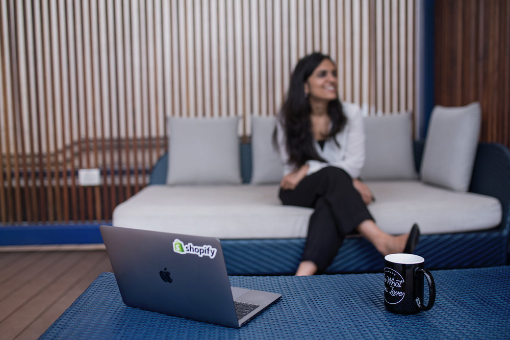 laptop and coffee on patio table