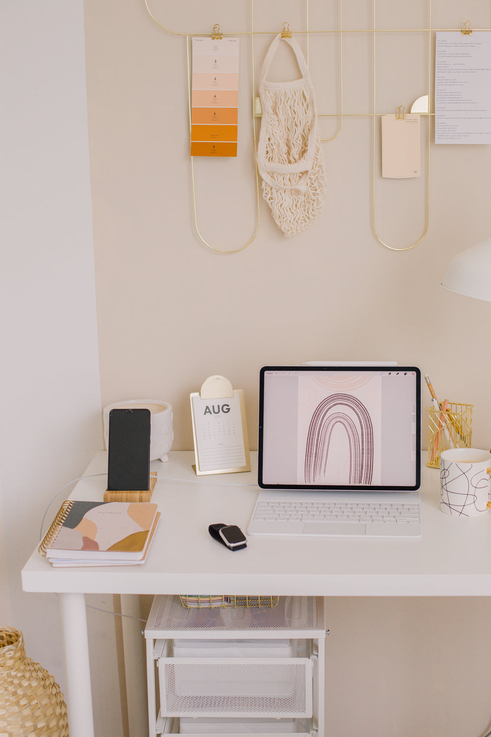 laptop on a the white desk of a home office