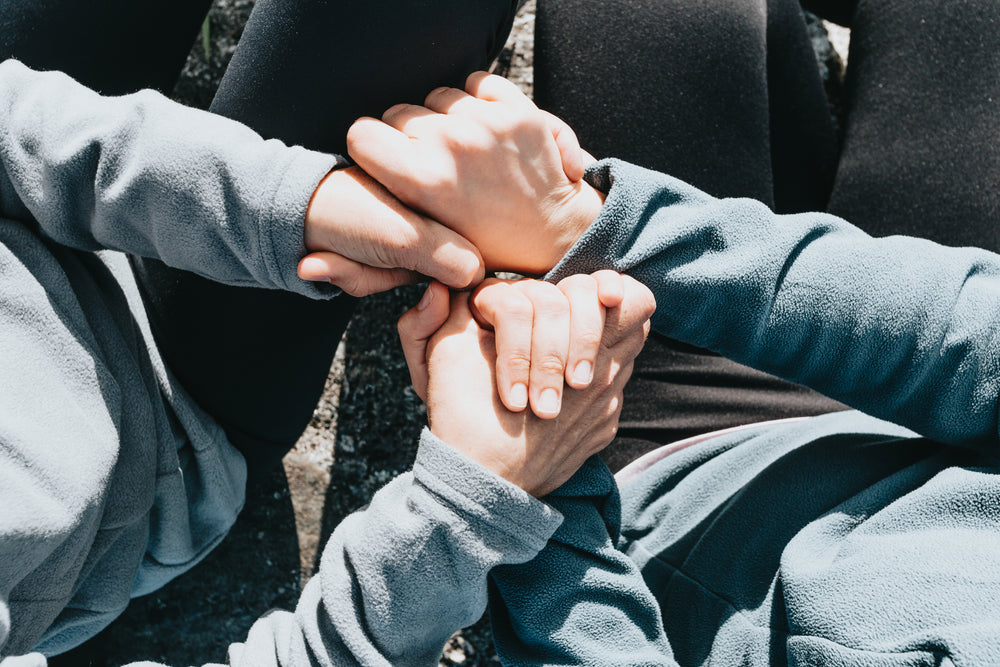 looking down toward people holding hands and sitting