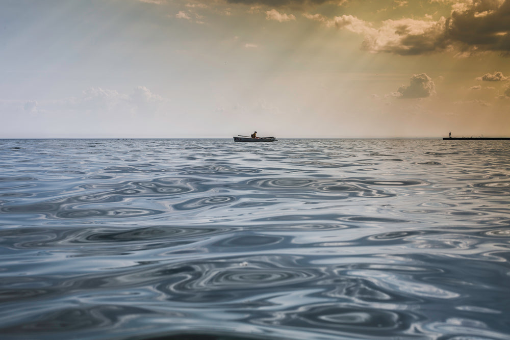 man canoeing on water