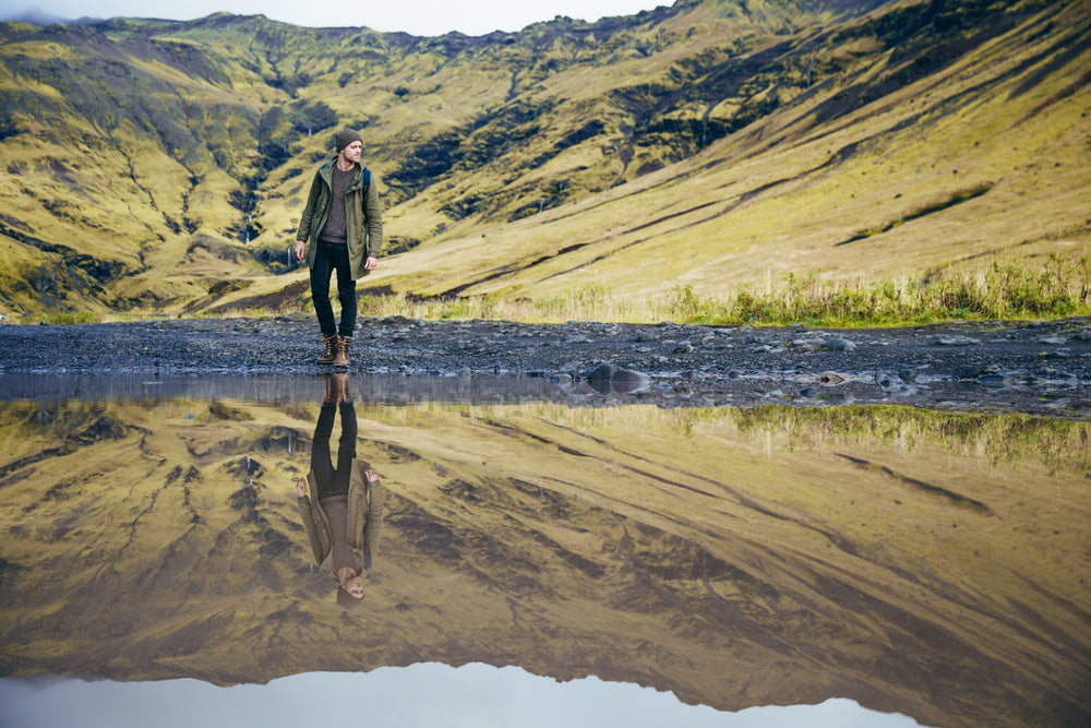 man & lake reflection