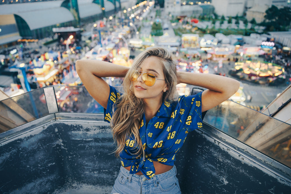 model poses casually on ride