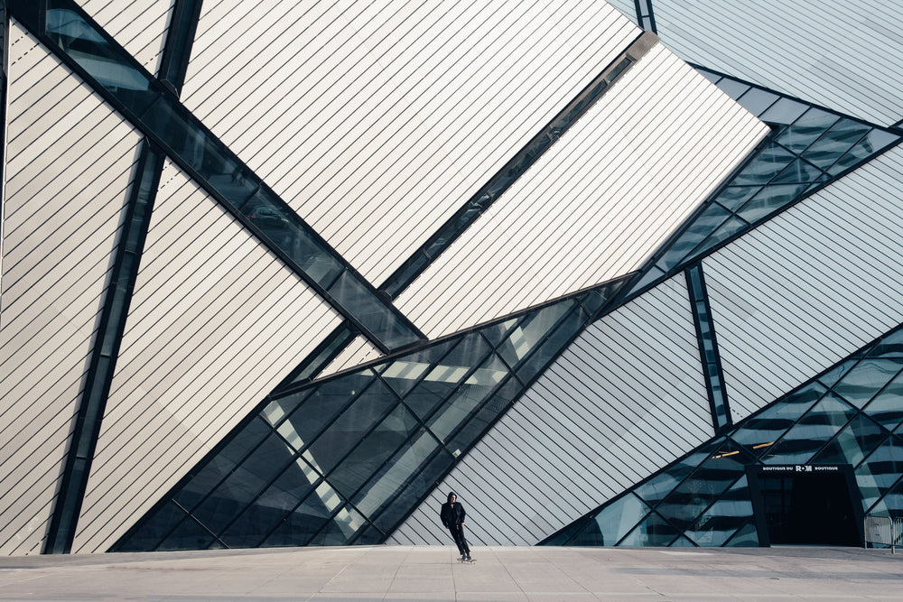 skateboarder in front of rom