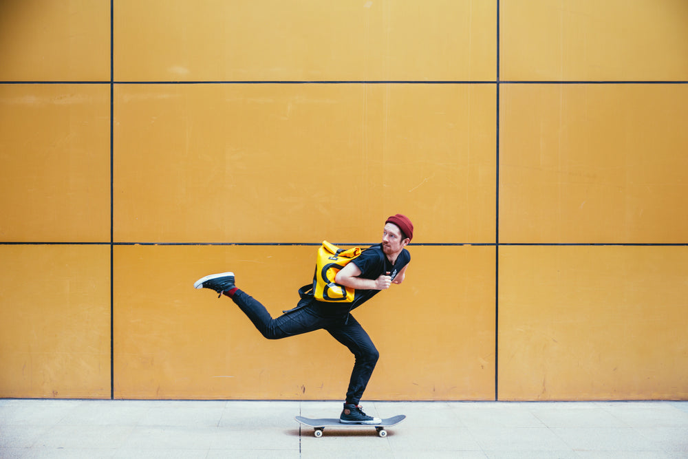 skateboarder rides past