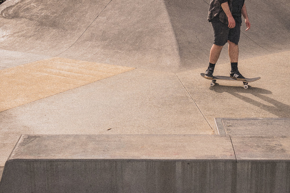 skater at skatepark with film grain