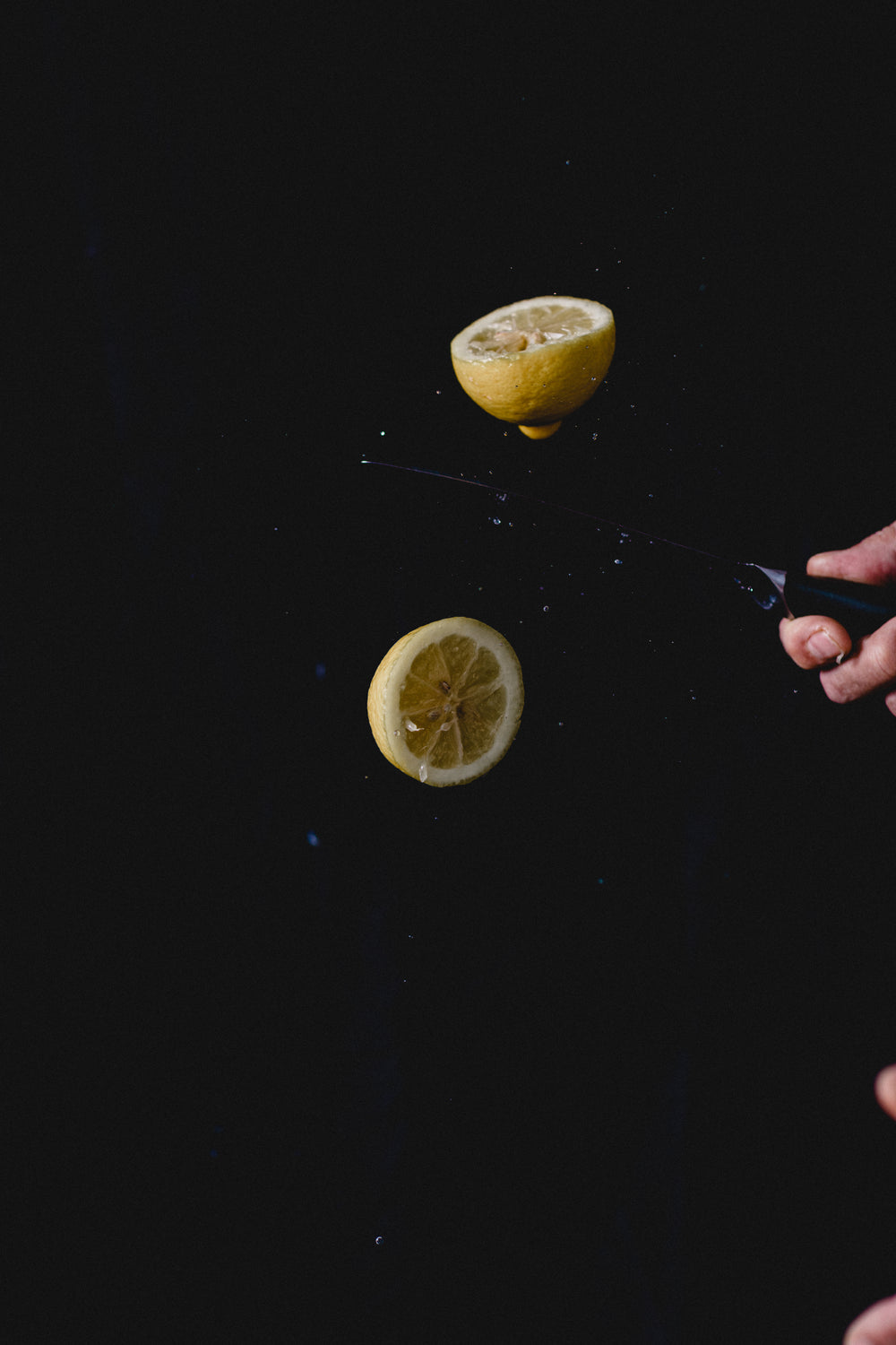 slicing a lemon in half