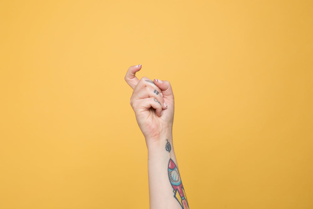 the letter "x" displayed in american sign language