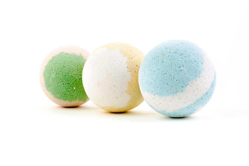 three colorful bath bombs