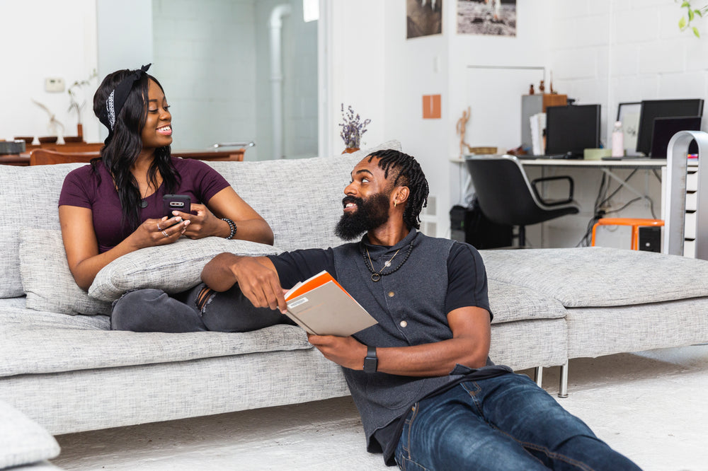 two people sitting in their lounge