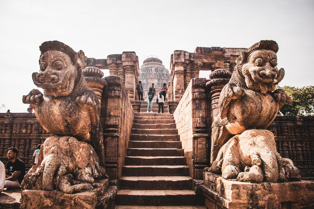 two stone sculptures with stairs in the middle