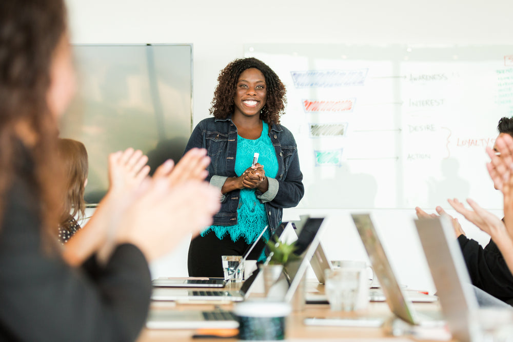 woman happy leading meeting