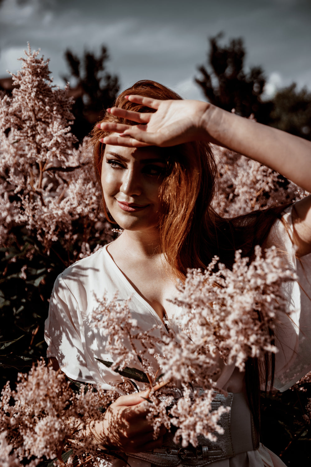 woman in flower blossoms