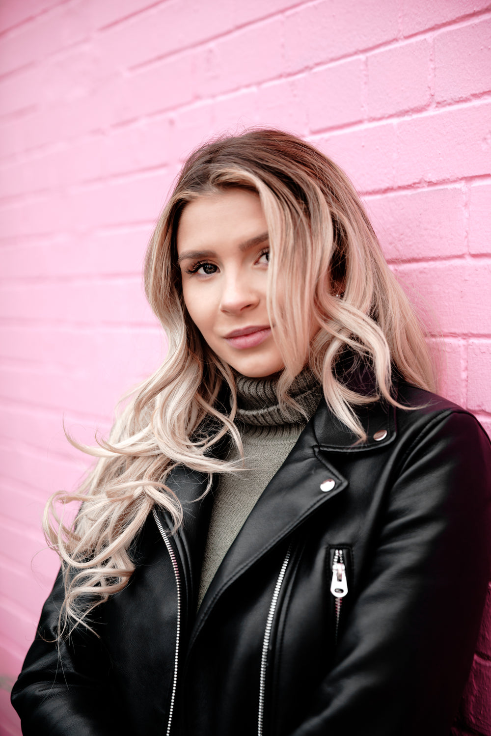 woman portrait on pink brick