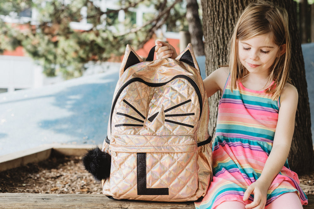 young girl with new backpack for school