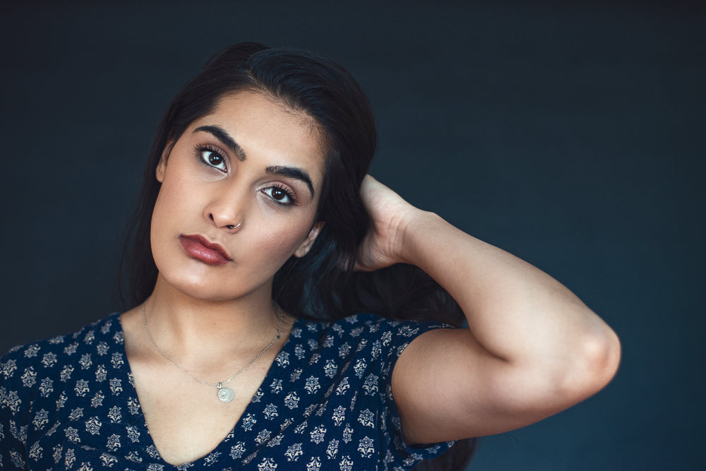 young woman tilts her head